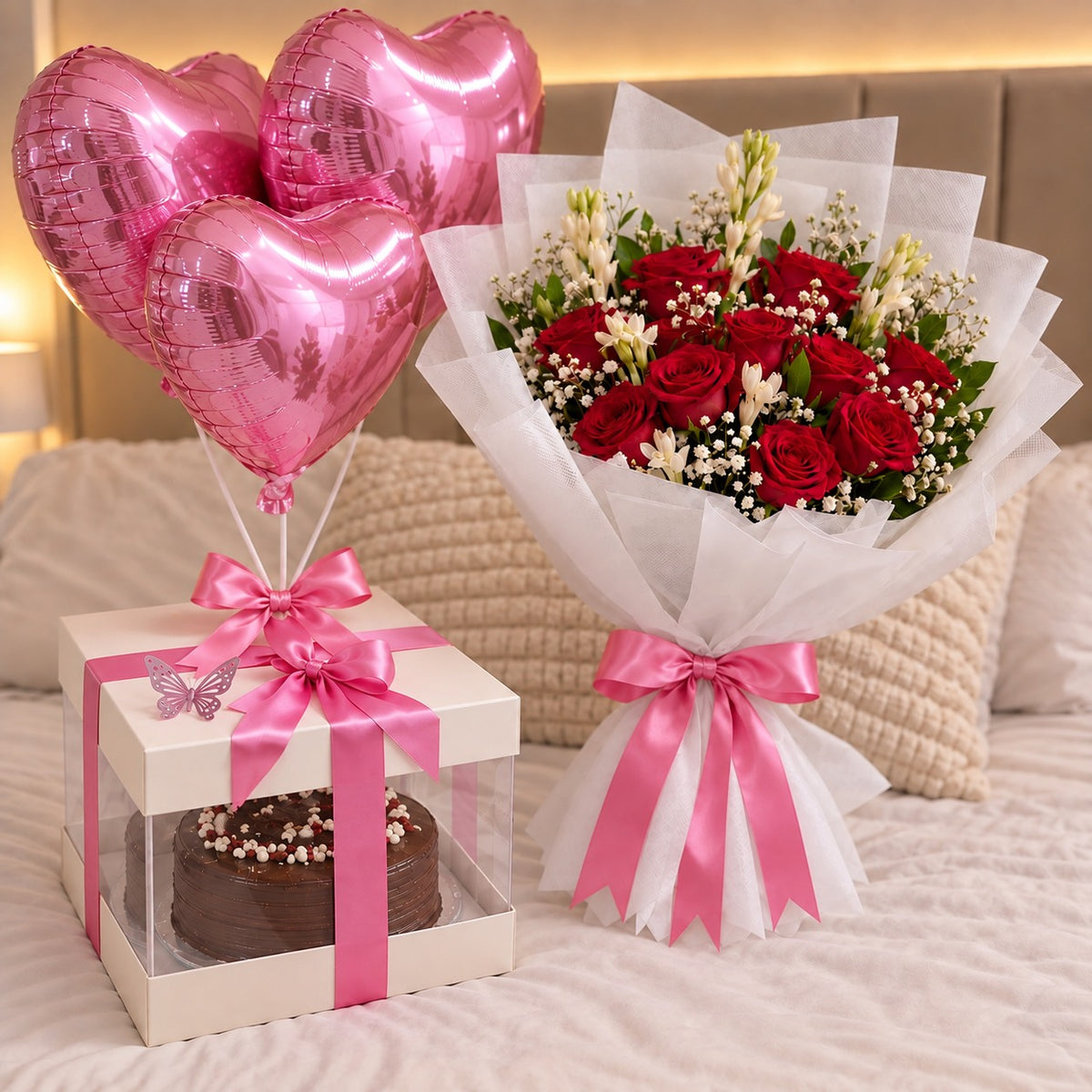 Chocolate birthday cake gift box with pink heart balloons and red rose bouquet