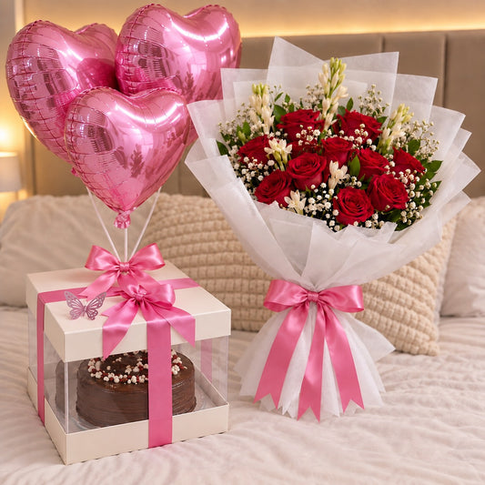 Chocolate birthday cake gift box with pink heart balloons and red rose bouquet